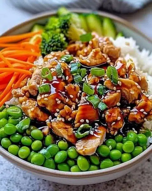 Teriyaki Turkey Rice Bowl with vegetables and sauce in a bowl