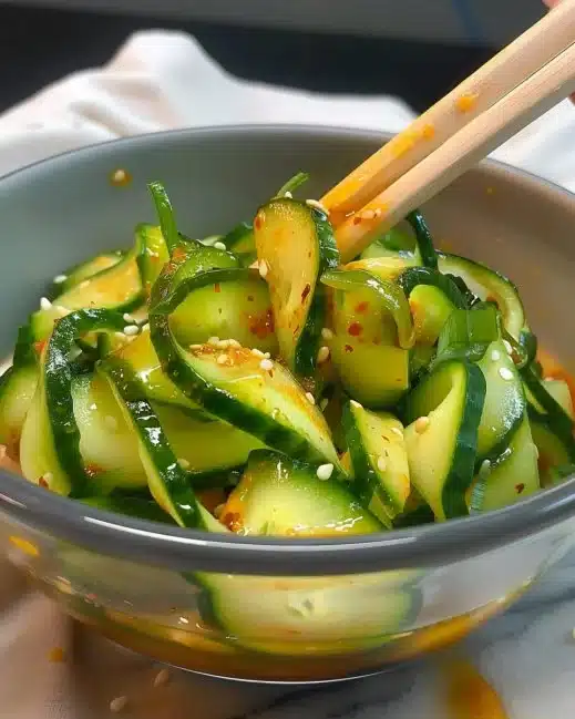 Fresh Asian cucumber salad with vibrant vegetables and a tangy dressing