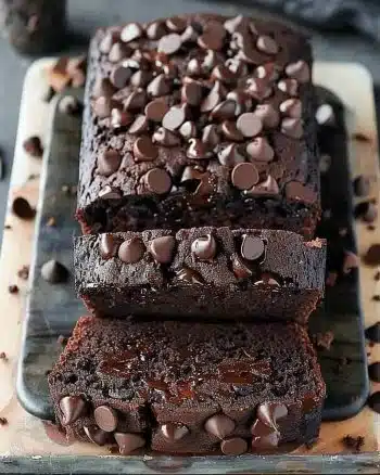 Delicious slice of chocolate banana bread topped with chocolate chips