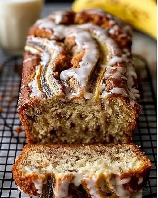 Slice of cinnamon swirl banana bread with a crispy crust and moist center
