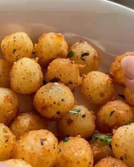 Crispy potato balls served on a plate as a tasty snack or appetizer