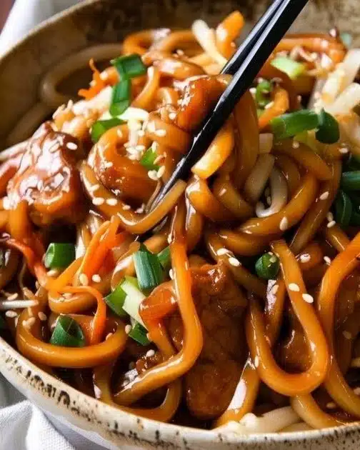 Delicious easy yaki udon served in a bowl with vegetables and sauce