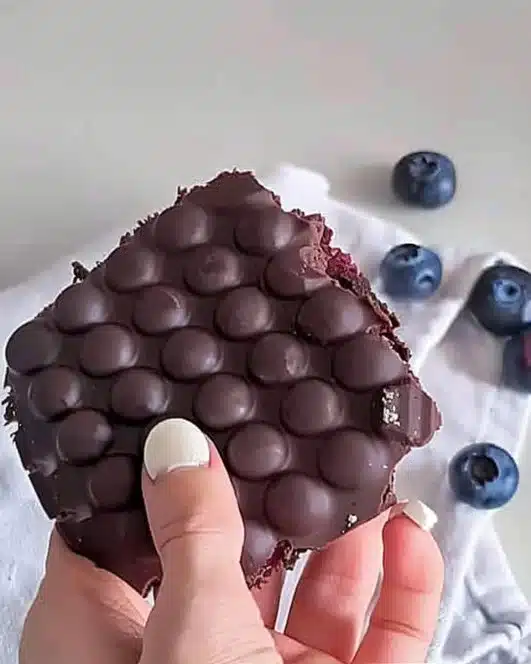 Guilt-free chocolate fruit dessert with fresh berries and melted chocolate