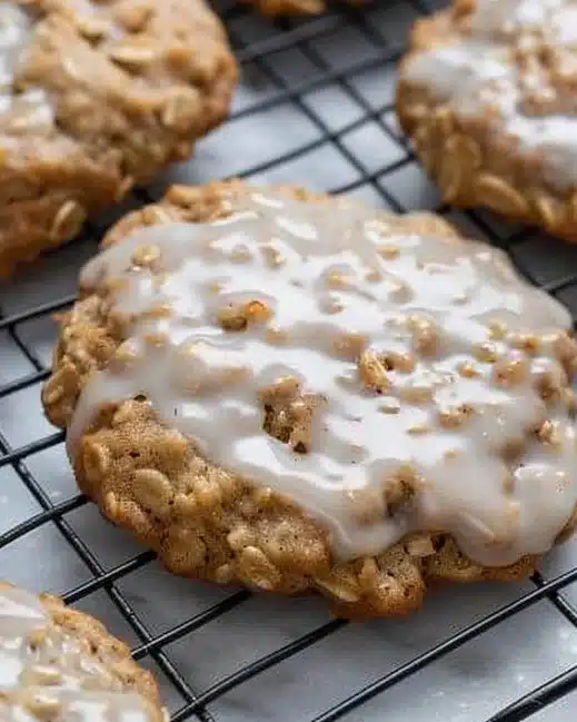 Delicious iced oatmeal cookies with a sweet glaze on a plate