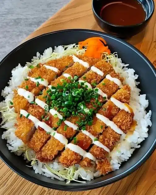 Delicious Japanese Katsu Bowl with crispy breaded chicken over rice