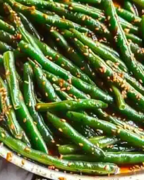 Plate of delicious miso green beans garnished with sesame seeds