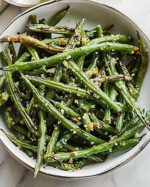 Oven-roasted green beans seasoned and ready to serve.