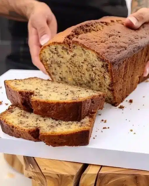 Delicious slice of vegan banana bread on a wooden table