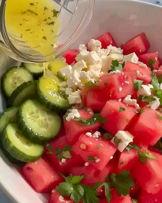 Refreshing watermelon cucumber salad with feta and mint.