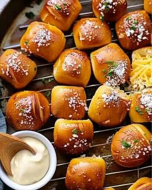 Fluffy air fryer pretzel bites served with mustard dipping sauce