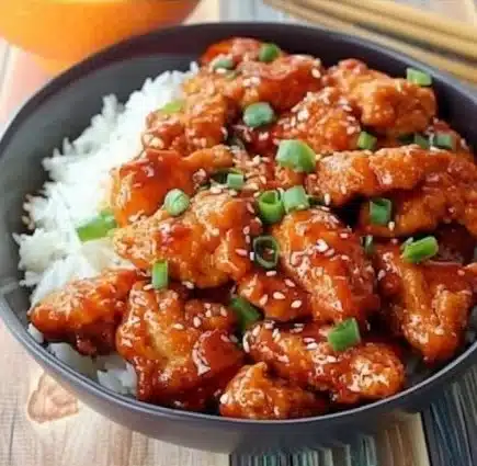 Delicious 4-Ingredient Orange Chicken served with rice and vegetables