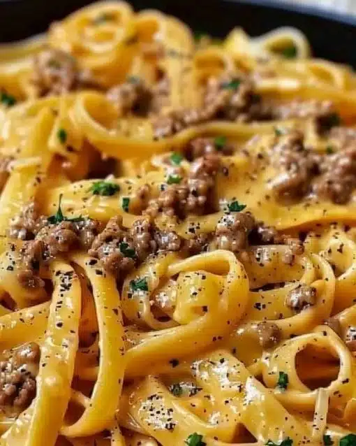 Creamy garlic butter pasta dish with ground beef served in a bowl