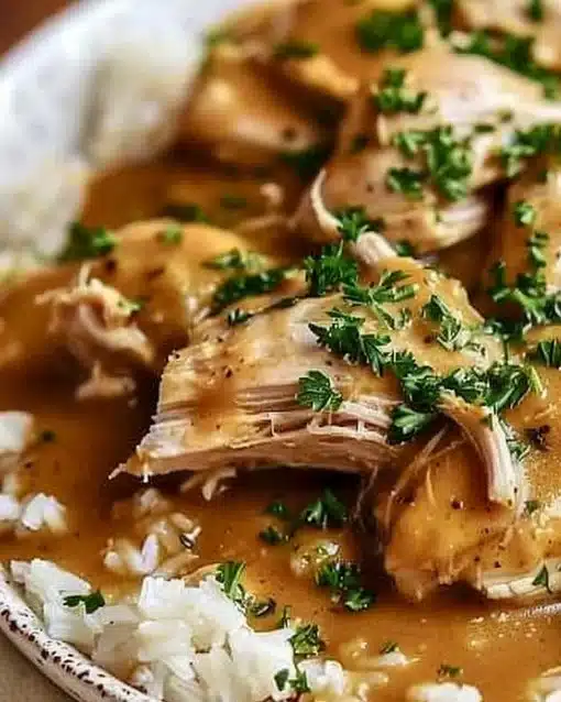 Crockpot Chicken with Gravy served on a plate, delicious and easy to make.