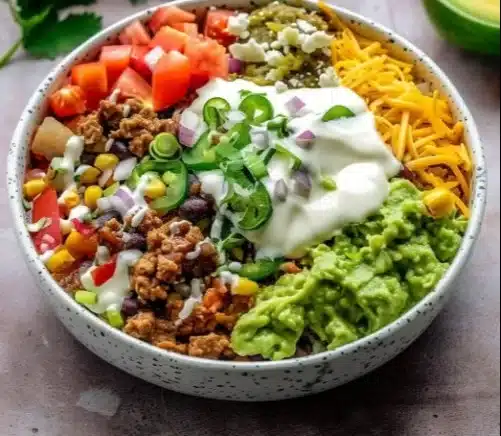 Low carb burrito bowl with fresh ingredients in a white bowl