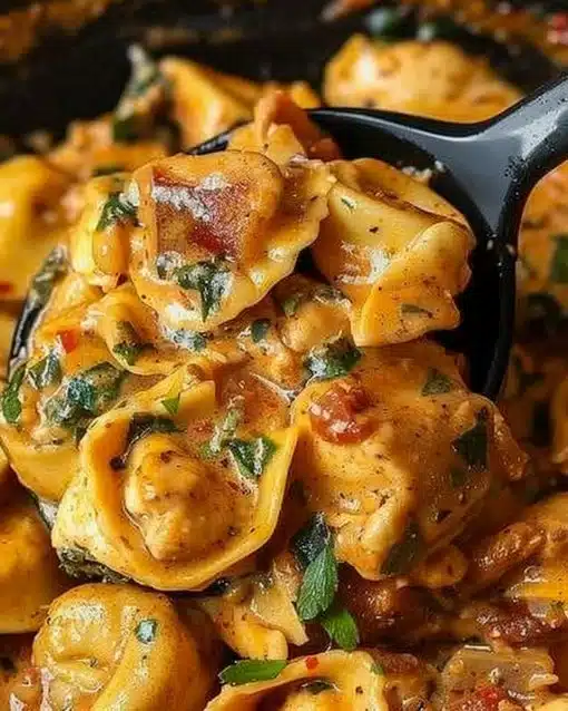 Delicious Marry Me Chicken Tortellini served in a creamy sauce with fresh herbs.