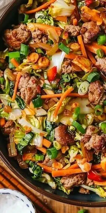 Paleo Egg Roll Bowl filled with vegetables and protein