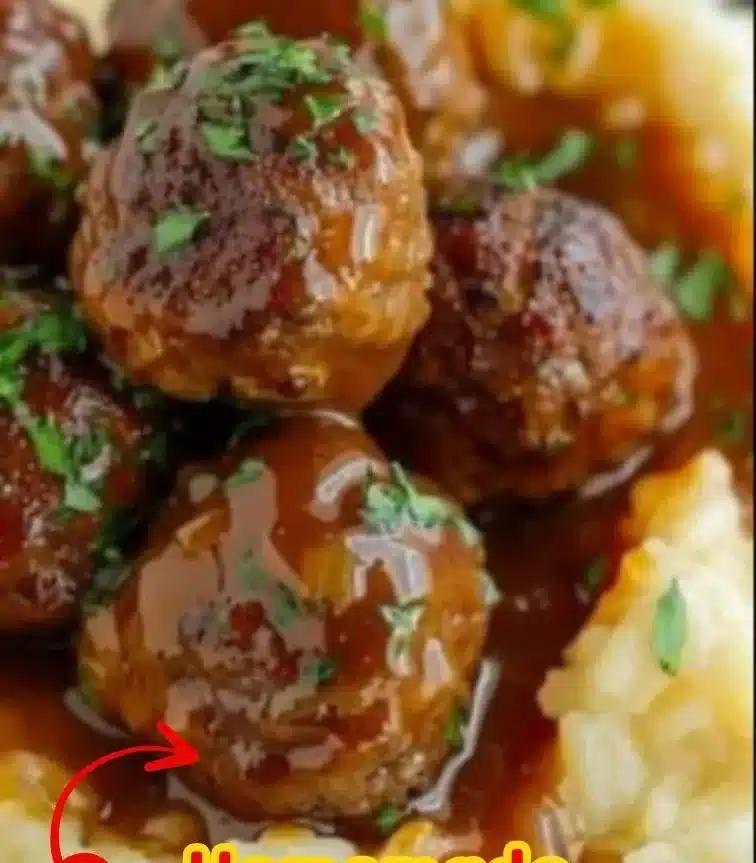 Slow Cooker Salisbury Steak Meatballs served with gravy on a plate