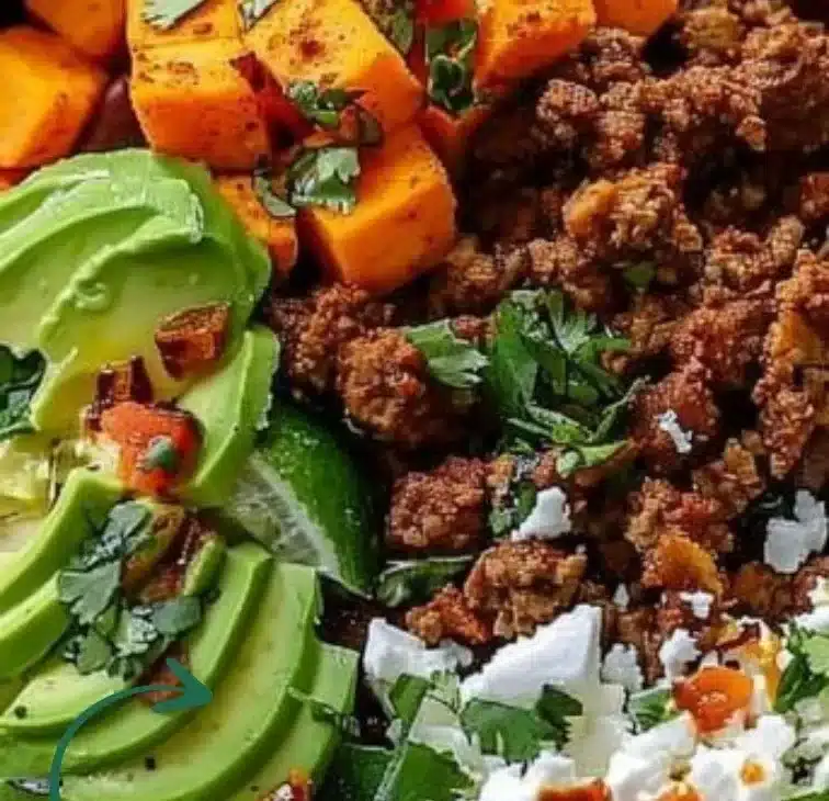 Sweet potato taco bowls garnished with fresh ingredients for a vibrant meal.