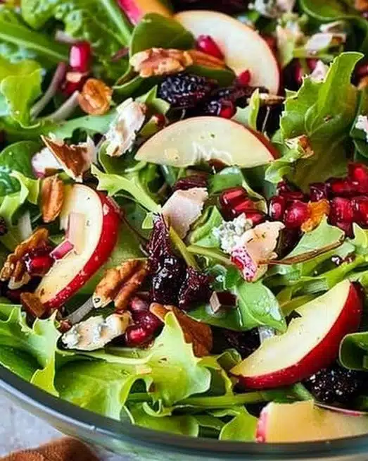 A colorful and festive Thanksgiving salad featuring seasonal ingredients.