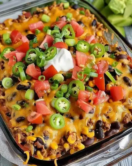 Delicious Walking Taco Casserole served in a dish with toppings.