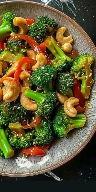 Broccoli cashew stir-fry with colorful vegetables in a bowl