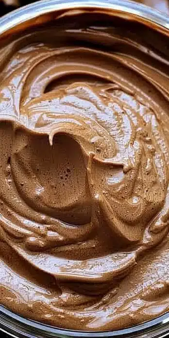 Delicious Keto Chocolate Mousse topped with whipped cream and keto chocolate shavings