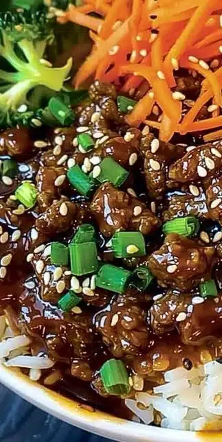Delicious Korean Beef Bowl topped with vegetables and sesame seeds
