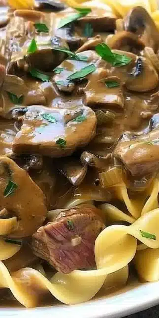 One-Pot Beef Stroganoff served in a bowl with fresh herbs on top