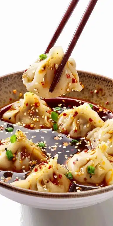 Delicious dumpling dipping sauce served in a small bowl