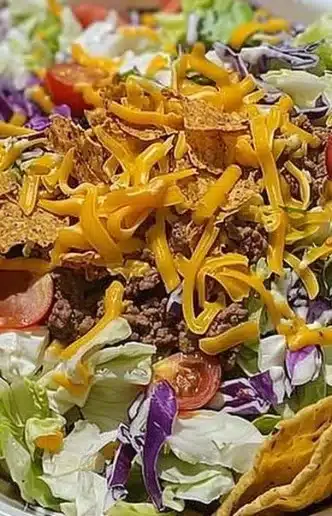Delicious Frito Cowboy Cabbage served in a bowl with toppings.