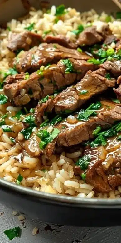 Delicious Garlic Butter Beef served over flavorful rice