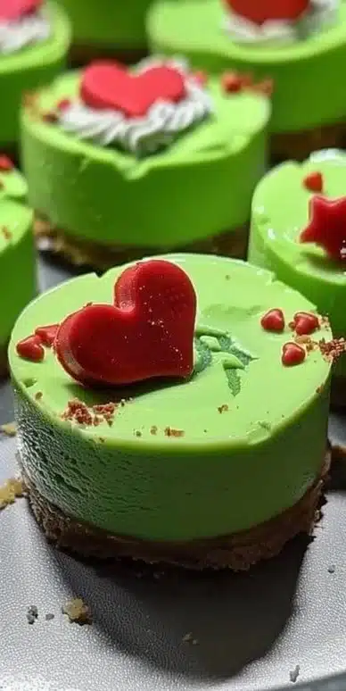 Delicious Grinch Mini Cheesecakes decorated for the holiday season