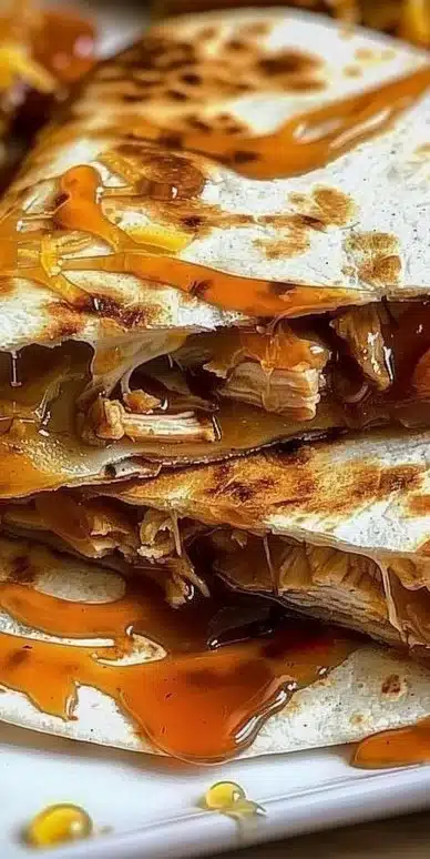 Delicious hot honey chicken quesadillas served on a plate.